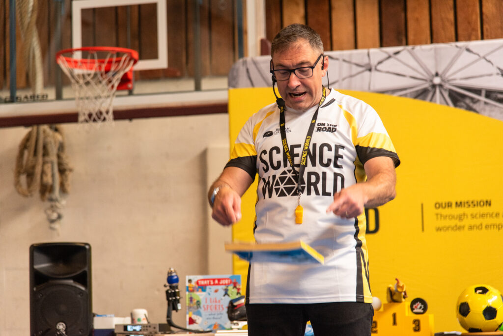 A man drops a phone book from mid-air.