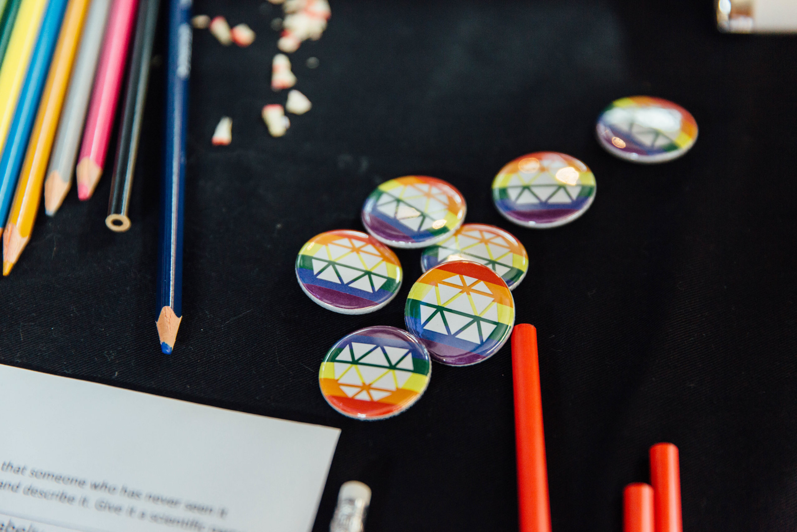 LGBTQ+ STEM Science World rainbow buttons for pride day.